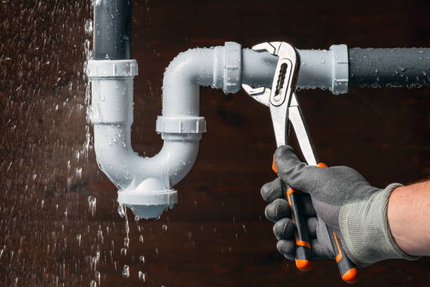 Professional Emergency Plumber technician working in Slickville, PA